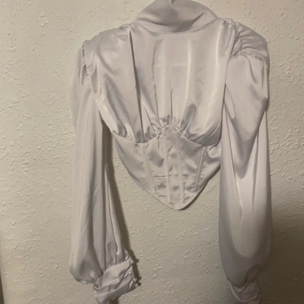 Corset top , brand new , white and a size 2